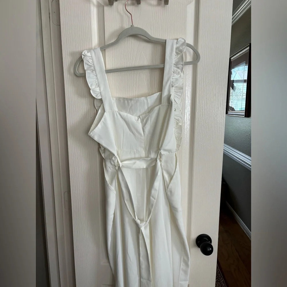 New without tags off-white jumpsuit. Size medium.‎